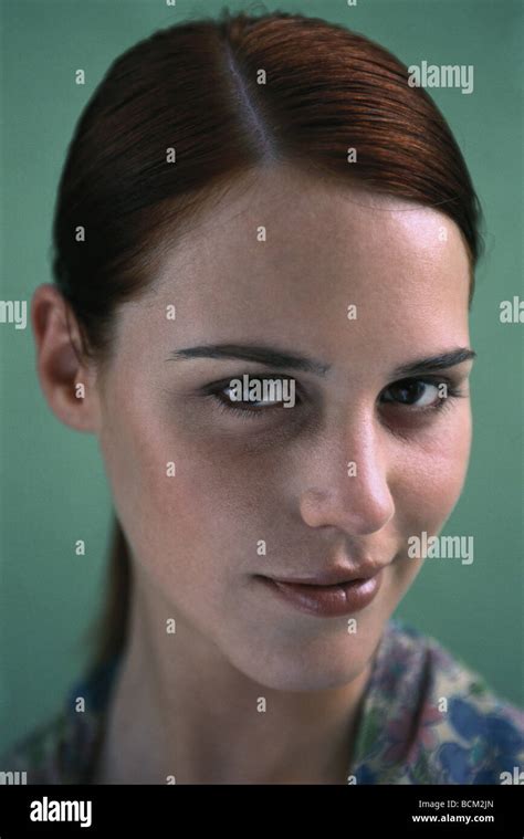 Young Woman Smirking At Camera Portrait Stock Photo Alamy