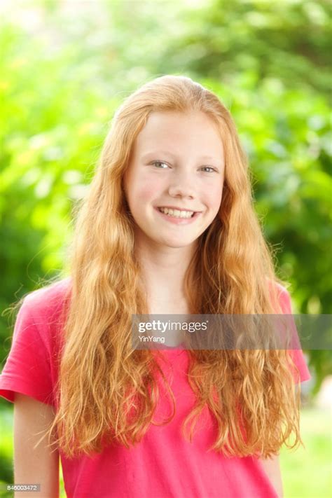 Portrait Of Caucasian Teenage Girl With Red Hair High Res Stock Photo