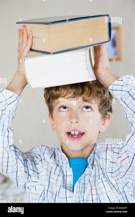 Boy With Books Stock Photo Alamy