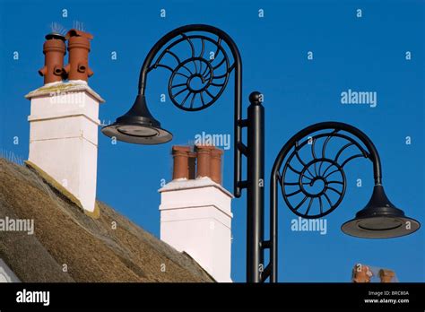 Chimneys And Ammonite Lamp Posts In Lyme Regis Stock Photo Alamy