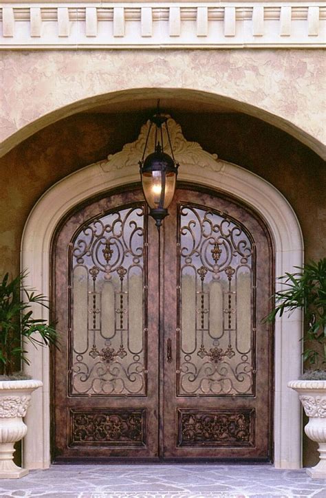 Wrought iron gate with color flowers and higher ground. How can we choose wrought iron doors and gates? - Quora
