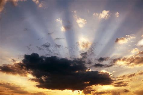 Beautiful Ray Of Light Sunset Clouds In The Blue Sky Stock Photo