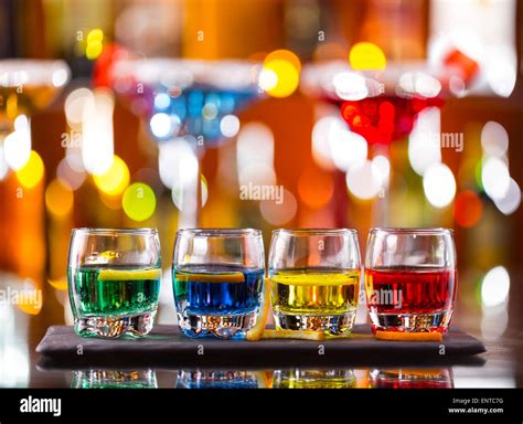 Variation Of Hard Alcoholic Shots Served On Bar Counter Blur Bottles