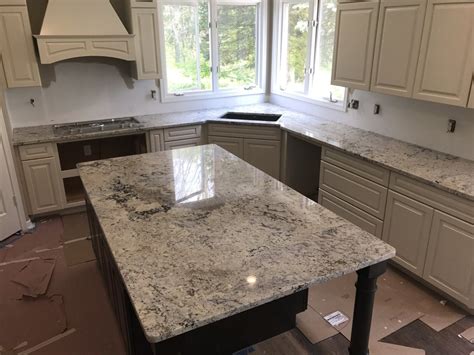 The floor is white tile with a tiny bit of marble effect (very slight) i think the granite will look fine since it is it sounds as though the op already has this white ice granite (with a decorative edge) and is. White Ice Granite Countertops - Yelp