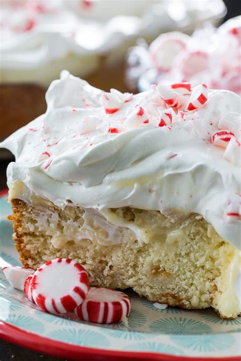 Pierce layers with a large fork at 1/2 inch intervals. White Chocolate Peppermint Poke Cake - Spicy Southern Kitchen