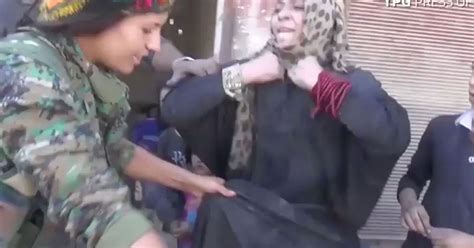 woman s incredible defiant reaction after being liberated from isis as terror group is driven