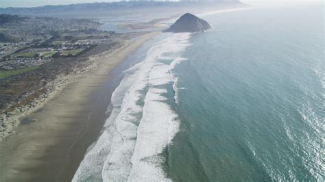 Flying Over Morrow Strand Beach Revealing Morro Rock Morro Bay