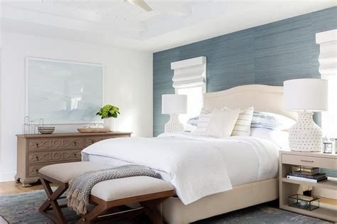 Wallpapered accent bookshelves by paper moon painting for haven design & construction. An accent wall covered in blue grasscloth wallpaper ...