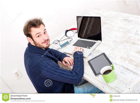 A Young Man Working Online In The Home Office Stock Photo Image Of