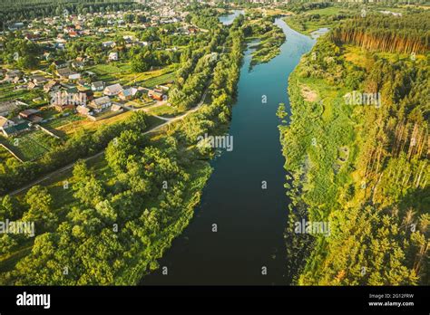 Aerial View Of Calm River And Village In Belarus Europe Green Forest