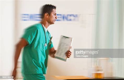 Doctor Entering Room Photos And Premium High Res Pictures Getty Images