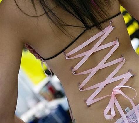 Corset Piercing On Back With Pink Ribbon