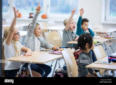 Children Raising Hands Hi Res Stock Photography And Images Alamy