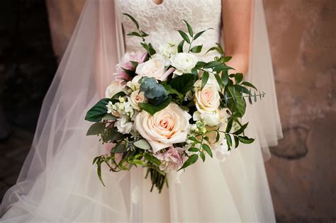 A Romantic Garden Style Wedding Bouquet With Hints Of Blush And Tons