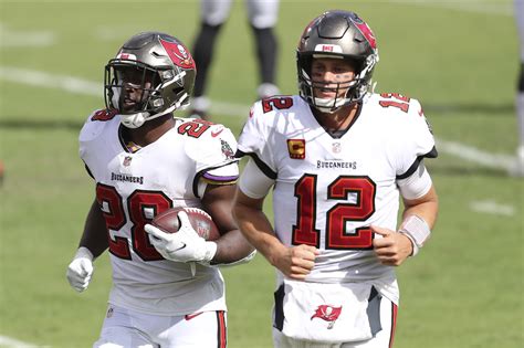 Tom Brady gets first Buccaneers win after week of drama