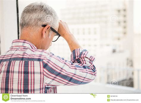 Troubled Casual Businessman Leaning Against Window Stock Image Image