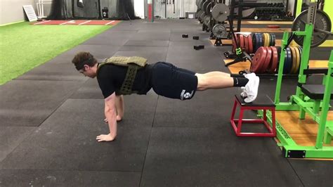 Feet Elevated Weighted Push Up Youtube