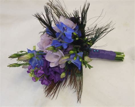 In this wedding invitation collection, hand painted original artwork by audrey jeanne roberts adds a unique, stunning luxe beauty. RJ's Florist: A peacock inspired wedding
