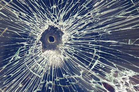 Bullet Hole In Glass Stock Photos Pictures And Royalty Free Images Istock