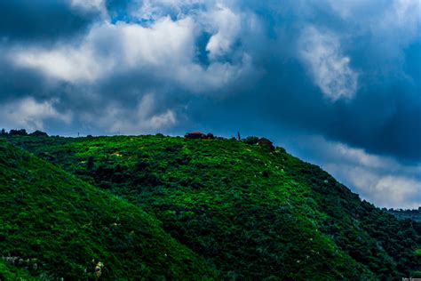 Landscape Photography Of Green Mountain Under Cloudy Sky · Free Stock Photo