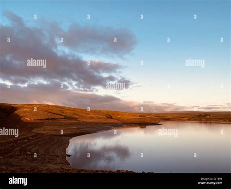 Sunrise Over A Lake Stock Photo Alamy