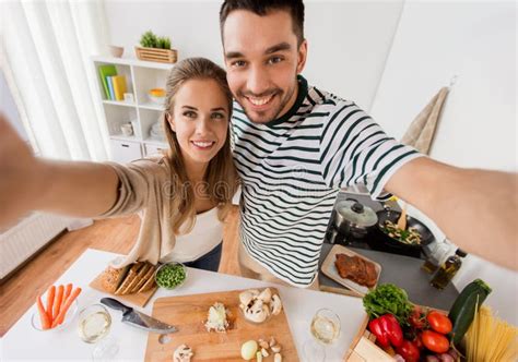Couple Cooking Food And Taking Selfie At Kitchen Stock Image Image Of