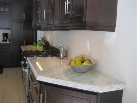 The use of white in the kitchen is a great way to keep the room feeling bright and open, even in a small space. Add Luxury to Your Kitchen with River White Granite ...