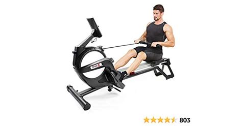 A Man Sitting On An Exercise Rowing Machine