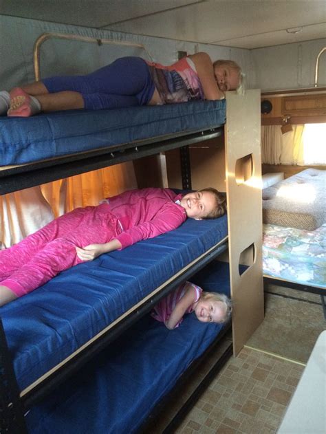 The tochta mattress is custom made and provides amazing comfort. Triple bunk made from garage shelving from Bunnings ...