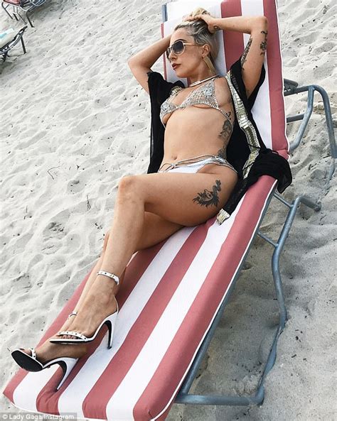 Royal Peach Lady Gaga Flaunts Her Curves In A Daring Gold And White Thong Bikini During Miami