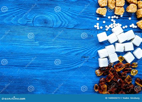 Sugar Lumps For Sweet Food Cooking On Kitchen Blue Table Top View Mock