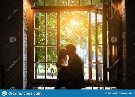 Young Couple In Love Standing By The Window Stock Image Image Of People Face 127243821