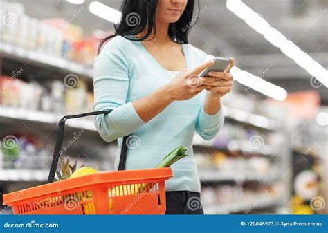 Woman With Smartphone Buying Food At Supermarket Stock Image Image Of