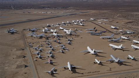 5k Stock Footage Aerial Video Orbit Around An Aircraft Boneyard In The