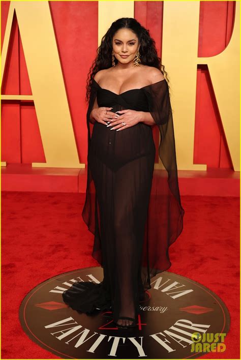 Vanessa Hudgens Cradles Pregnant Belly In Sheer Dress At Vanity Fair Oscars Party Photo