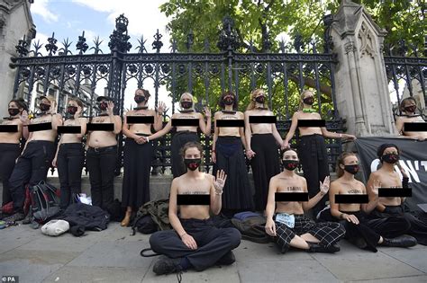 Topless Extinction Rebellion Activists Padlock Themselves To The Gates Of Parliament Daily