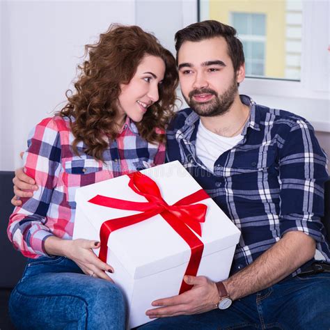 Unique gifts ideas for couples who have eveything. Young Couple With Big Gift Box Stock Photo - Image of ...