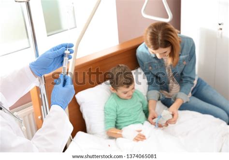 Doctor Adjusting Intravenous Drip Little Child Stock Photo 1374065081