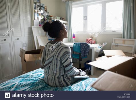 Thoughtful Teenage Girl Packing Preparing For College Stock Photo Alamy