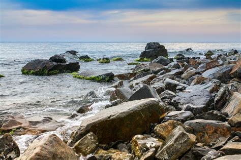 Seascape Scenic Large Stones Against The Sea And Sky Stock Photo