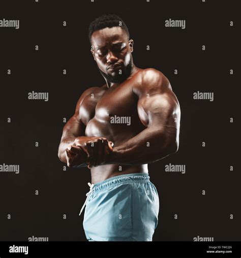 Man Flexing Muscle Black Stock Photos And Man Flexing Muscle Black Stock