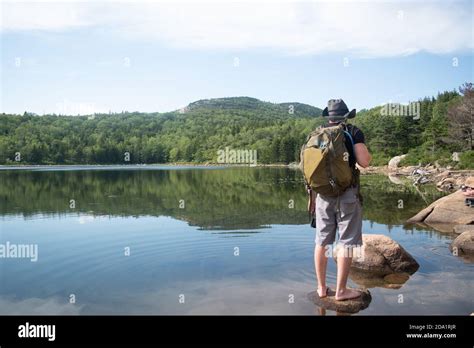 Man Exploring A Lake Stock Photo Alamy