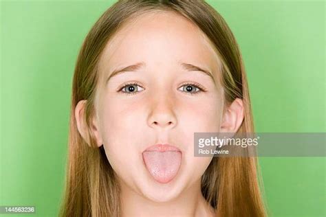 Portrait Of Teenage Girl 16 17 Sticking Tongue Out Bildbanksfoton Och