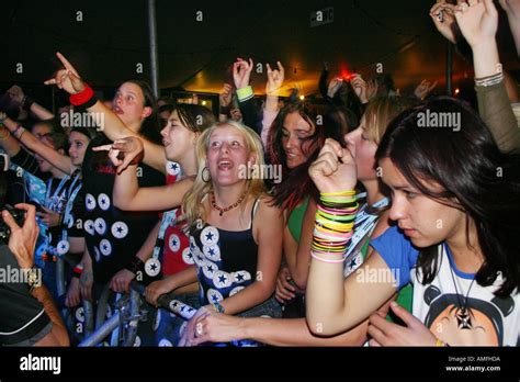 Elated Teenage Girls At Rock Concert Stock Photo Alamy