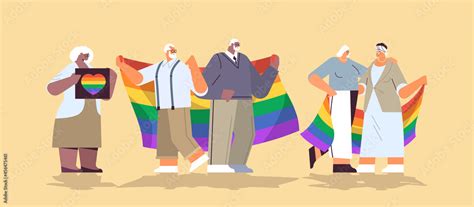 mix race senior people group holding lgbt rainbow flag gay lesbian love parade pride festival