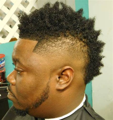 This curly afro mohawk or faux hawk haircut is one of the coolest haircuts for black men. 20 Creative Mohawks for Black Men