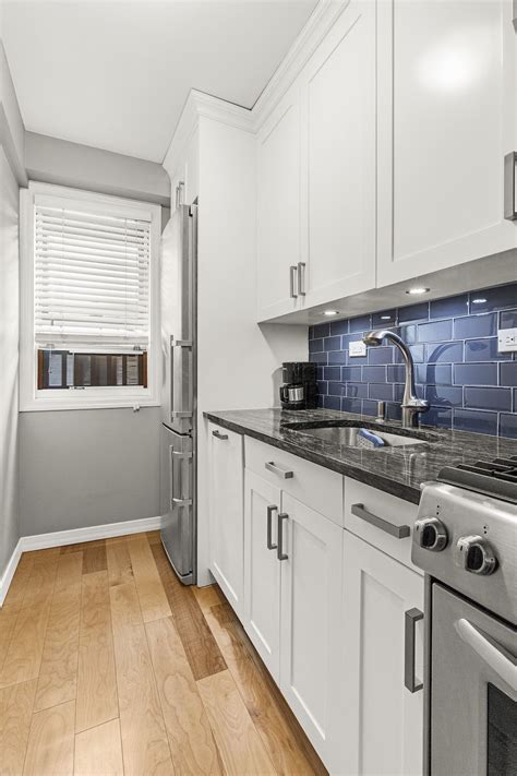 Refinishing kitchen cabinets is an economical way to update a kitchen. A Quick Fix Brightens a Kitchen | Refacing kitchen cabinets, Kitchen renovation cost, Kitchen ...