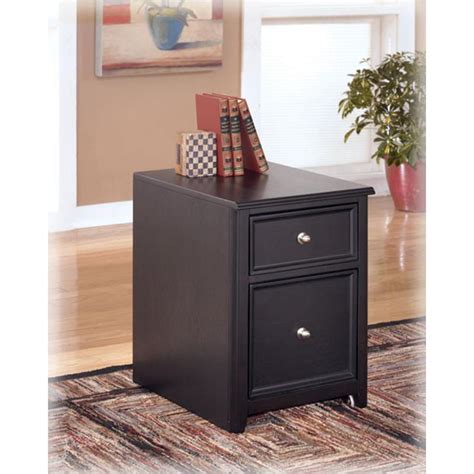 If you're interested in upgrading a home office, make sure you check out our home office furniture. H371-12 Ashley Furniture Carlyle - Black Home Office File ...