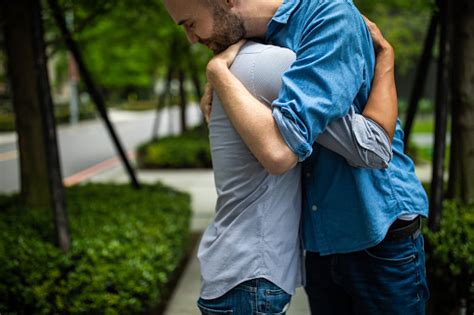 Two Gay Men Embracing On The Street Stock Photo Download Image Now