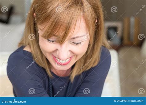 Woman Smiling Looking Down Stock Photo Image Of Caucasian Home